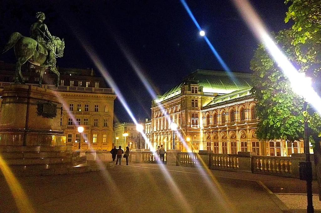 Vienna State Opera illuminated at night on Opernring in the historic center of Vienna.