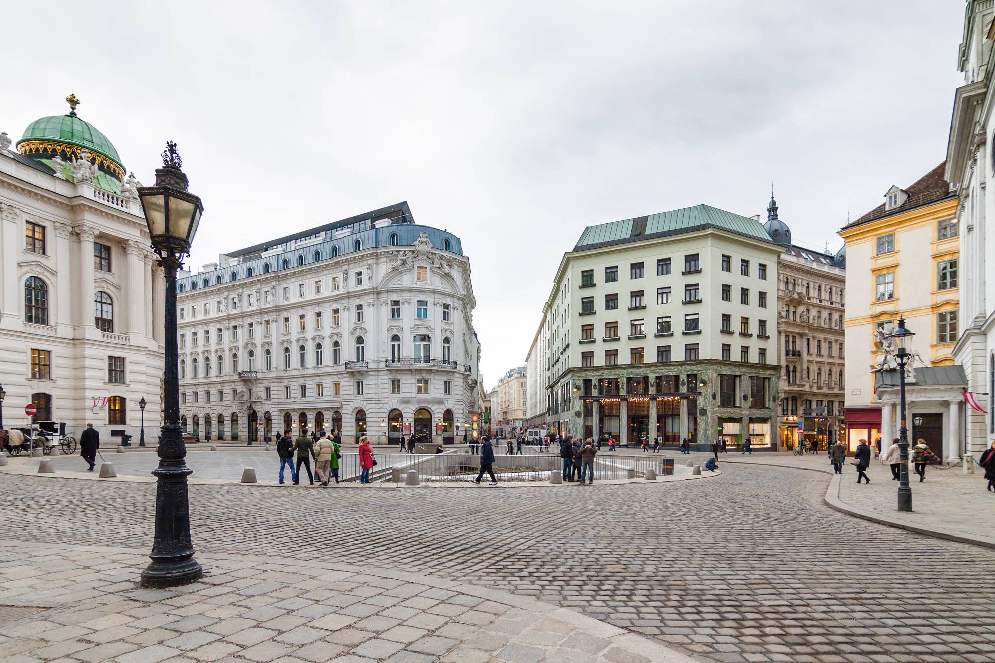 Cloudy view of Hofburg Palace at Michaelerplatz, Habsburg Empire landmark in Vienna, Austria. _© Neonyn Adobe Stock At Michaelerplatz, Vienna’s centuries do not line up politely. They face each other across one square.