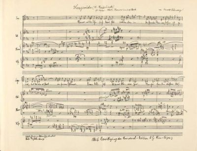 Reproduction of a handwritten musical score by Arnold Schönberg, with densely notated vocal and instrumental staves, performance markings and handwritten annotations across two systems.