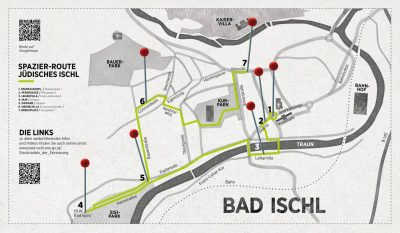 Map of Bad Ischl showing the green “Jewish Ischl” walking route with seven numbered stops, including Sparkassenplatz, Pfarrgasse, Villa Lehár, the former synagogue, Sisi Park, Hasnerallee and Kreuzplatz. Red pins mark additional sites, with the River Traun, Kurpark, railway station and Kaiservilla also labelled.